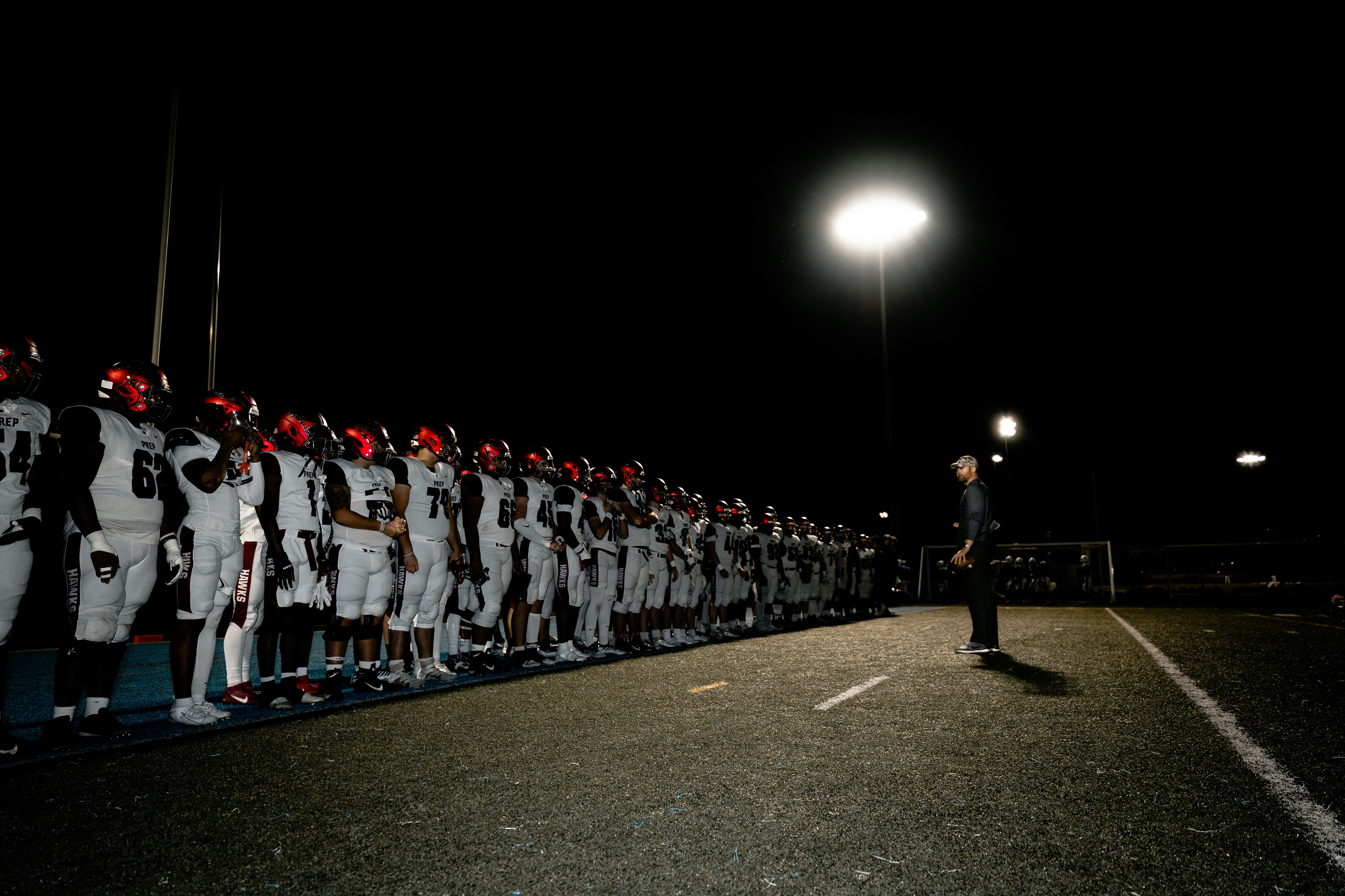 a group of people in white uniforms