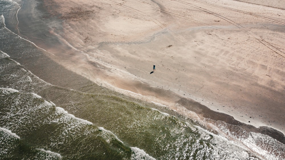 a person surfing on the waves