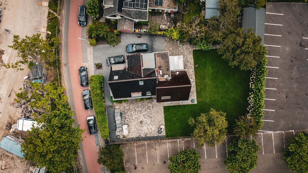 a building with a lawn and cars