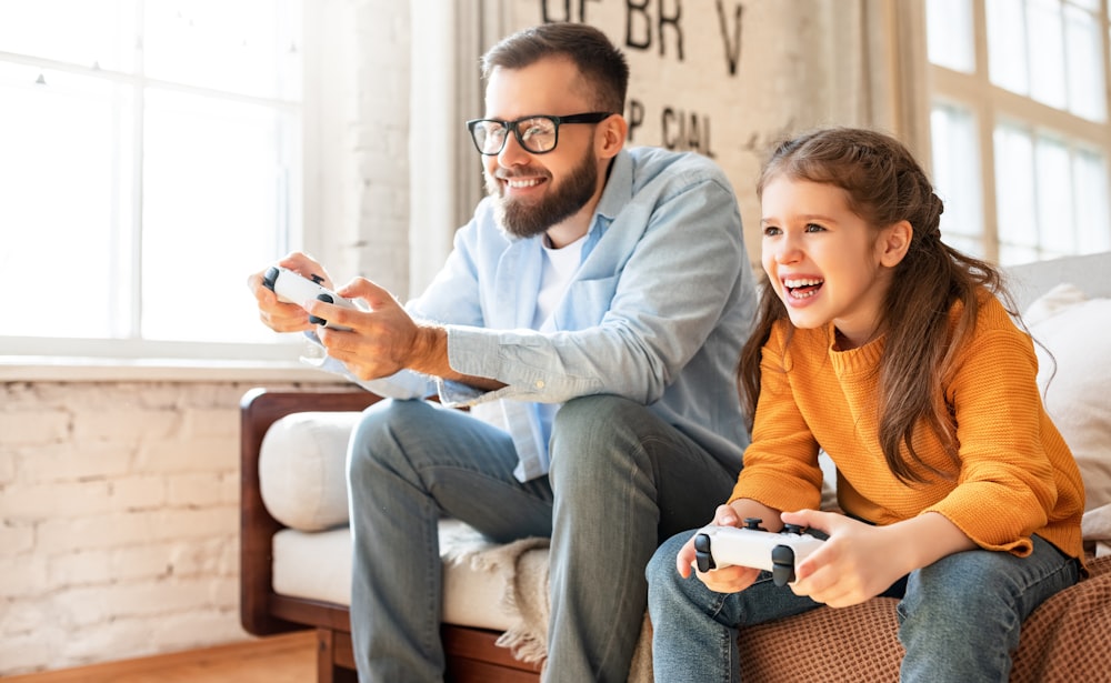 a person and a girl playing video games