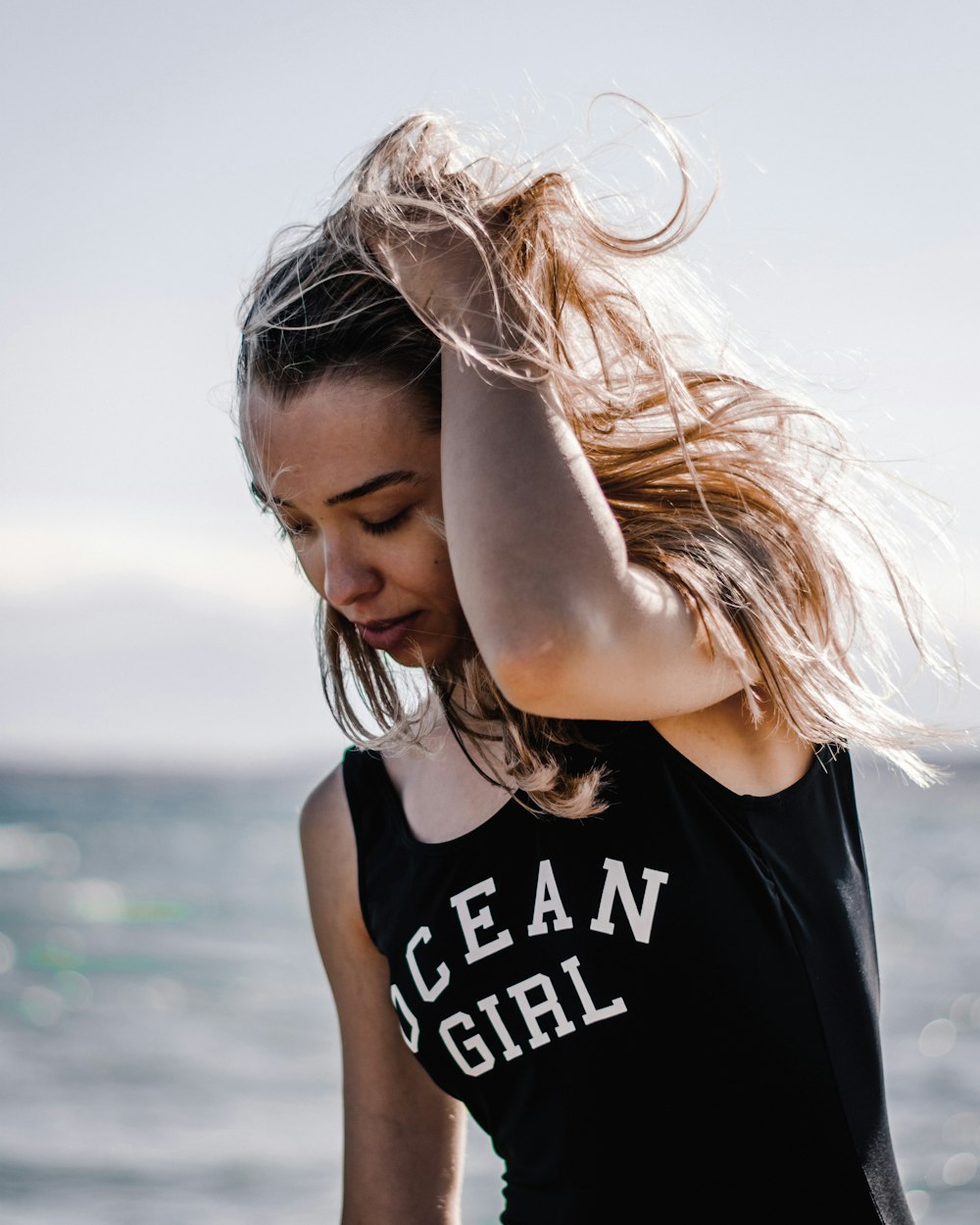 a woman with her hair blowing in the wind