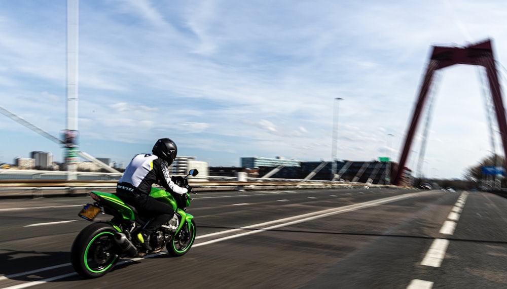 a man riding a motorcycle on a road