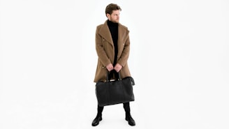 a man in a brown coat