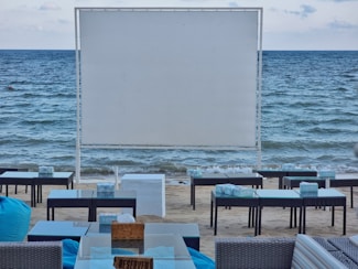 tables and chairs on a beach