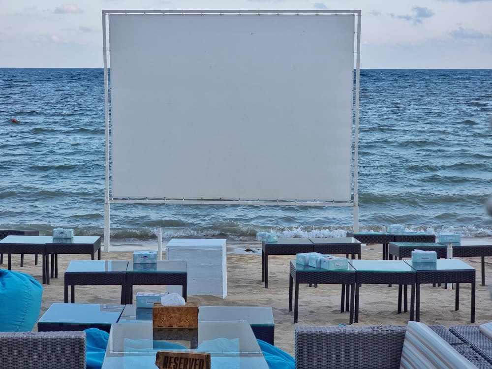 tables and chairs on a beach