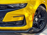 the front of a yellow car