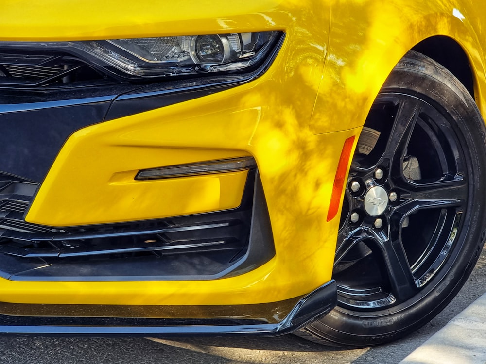 the front of a yellow car