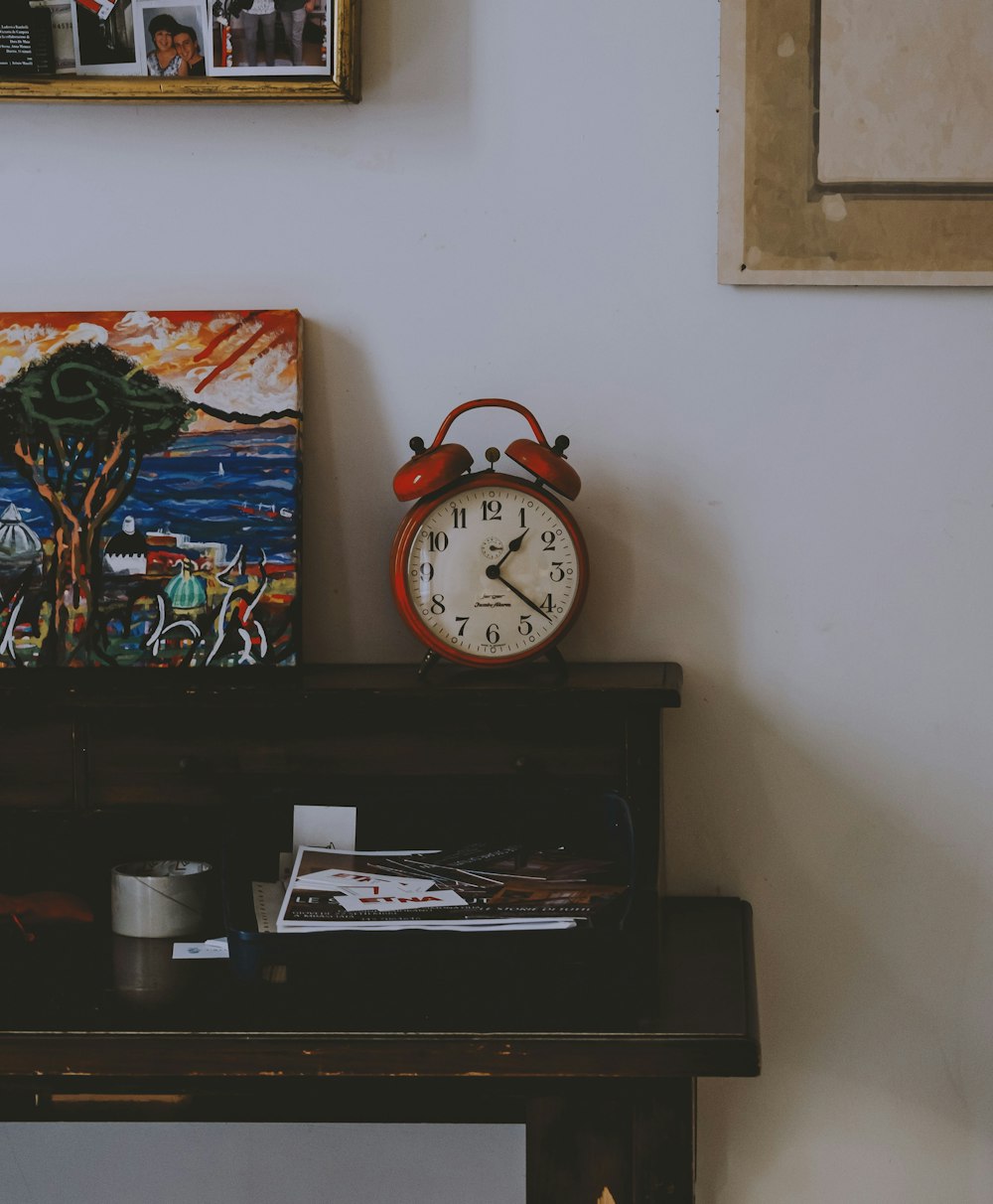 a clock on a shelf