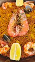 Close-up of a classic paella dish with vibrant saffron rice and fresh seafood.