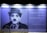 A large mural on a wall depicts a monochrome portrait of a man with a bowler hat and a mustache, reminiscent of early 20th-century style. To the right, a quote reads: 'Laughter is the tonic, the relief, the surcease for pain. - Charlie Chaplin' alongside its Korean translation.