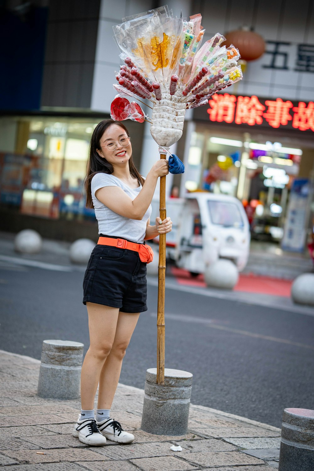 a woman holding a large umbrella