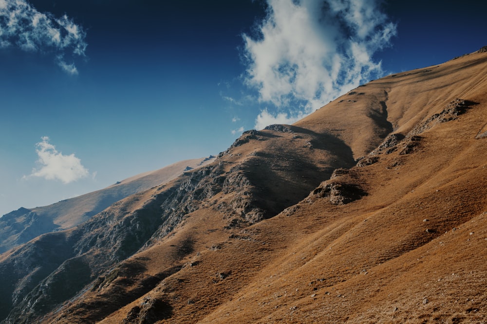 a mountain with a valley below