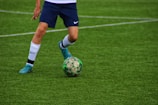 a football player kicking a ball