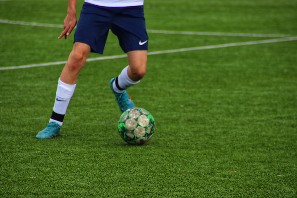 a football player kicking a ball