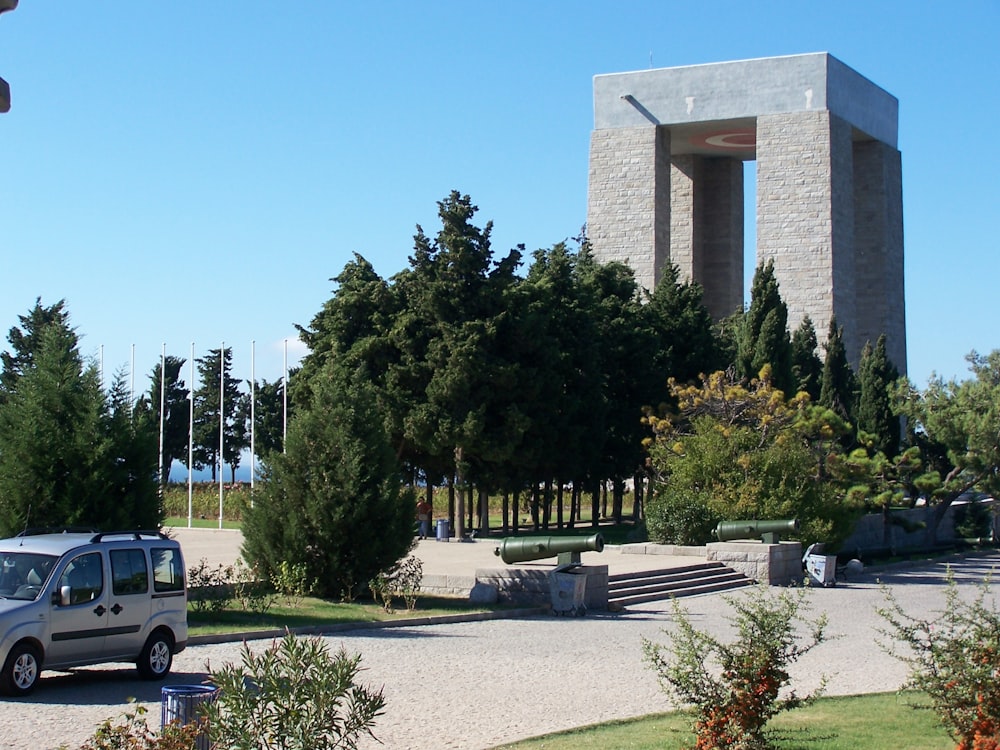 a building with a tower and trees