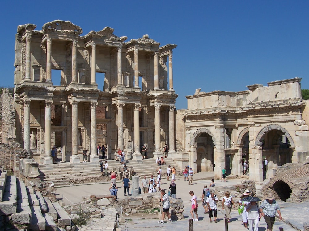 a group of people outside Library of Celsus