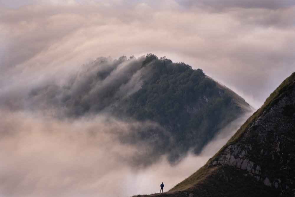 a person standing on a mountain