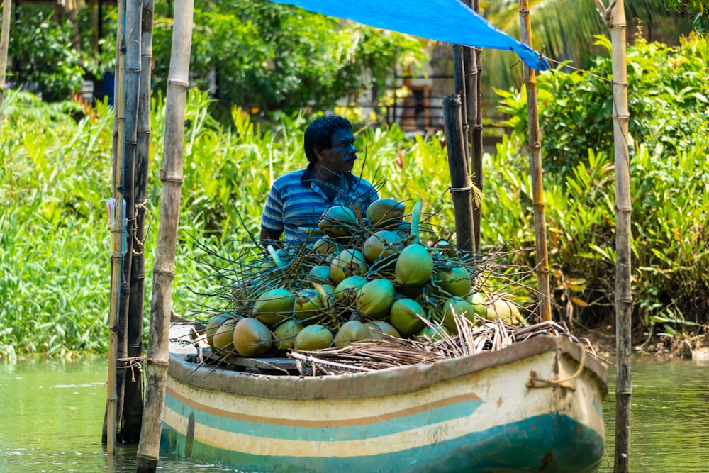 a person on a boat full of fruit