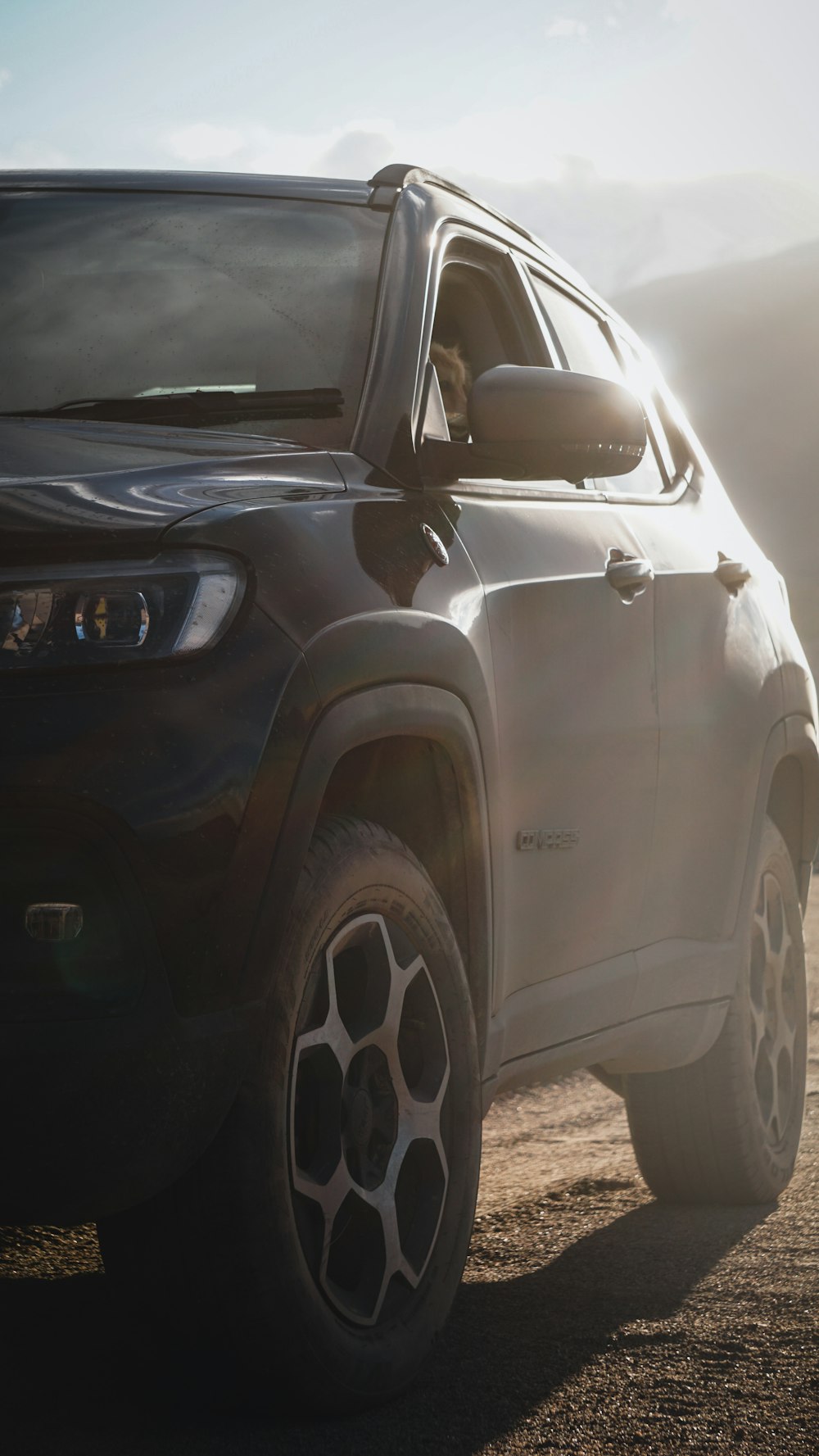 a car parked on a dirt road