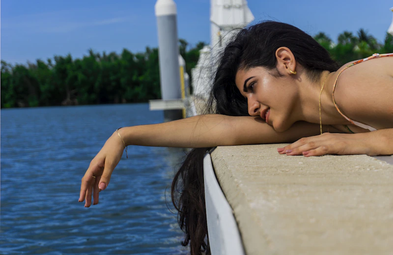 person lying relaxed on dock