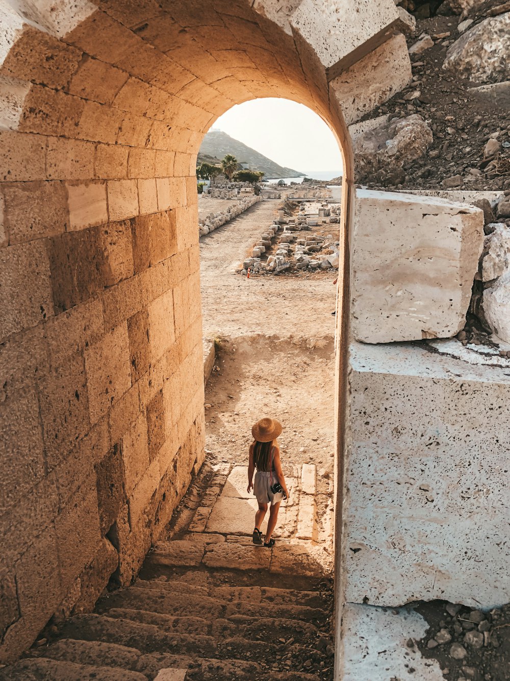 a person standing in a stone doorway