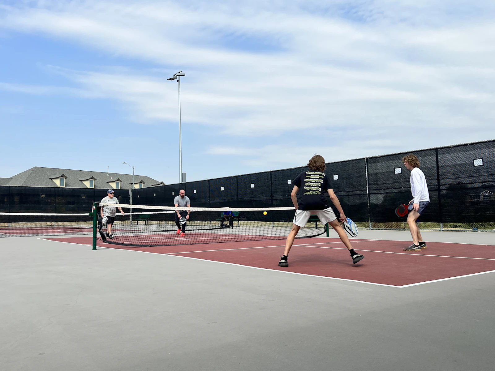 A small group training together on court during a coached session