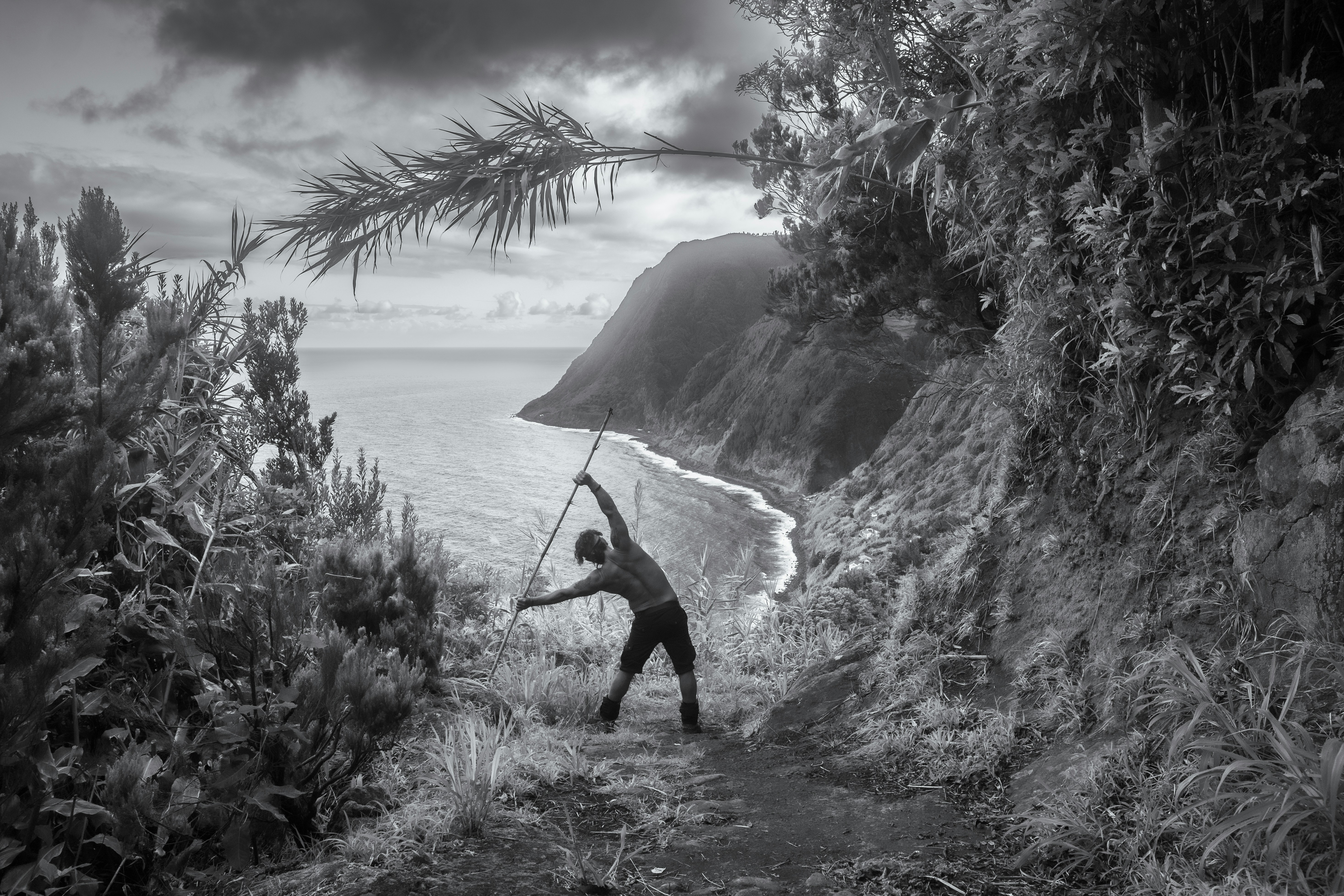 a person playing with a bow and arrow on a beach