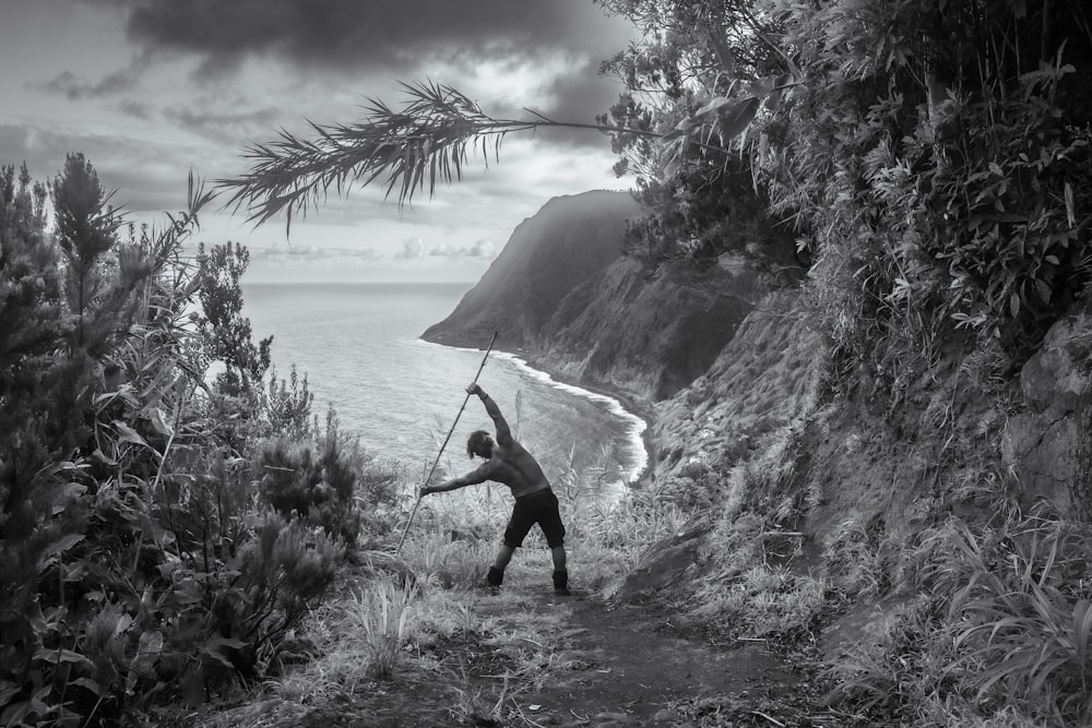 a person playing with a bow and arrow on a beach