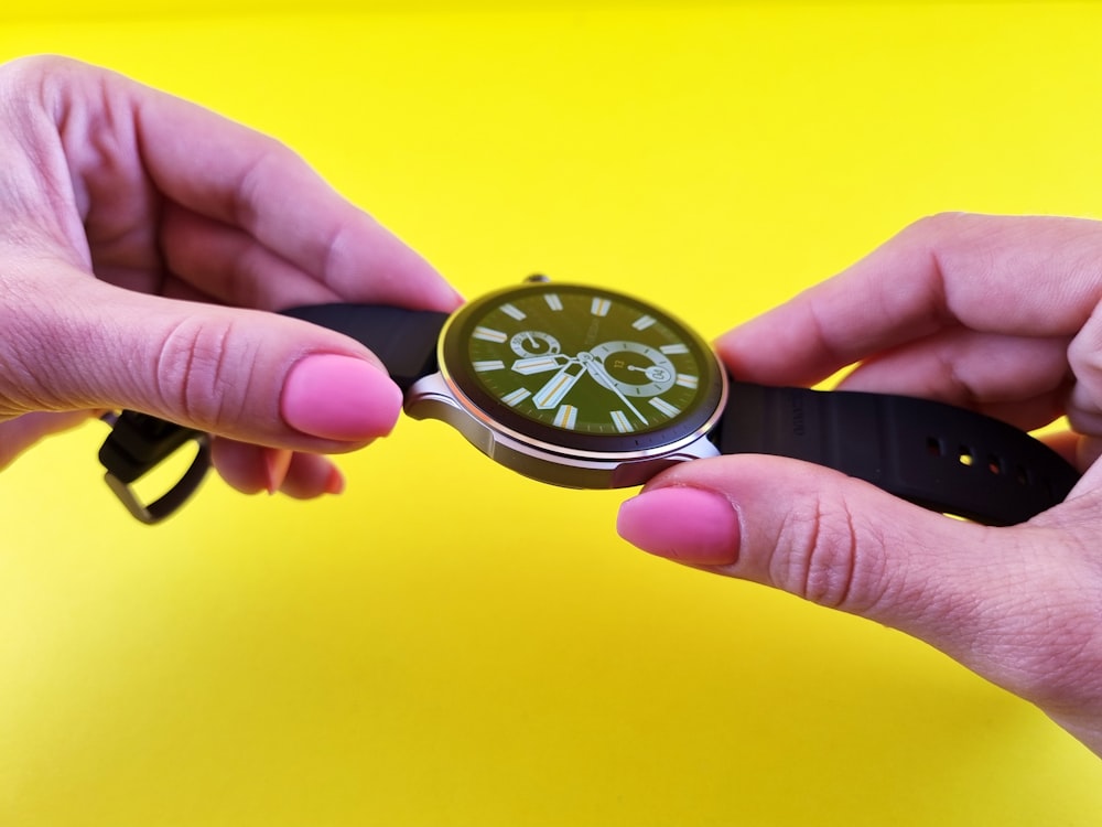 a person holding a stopwatch