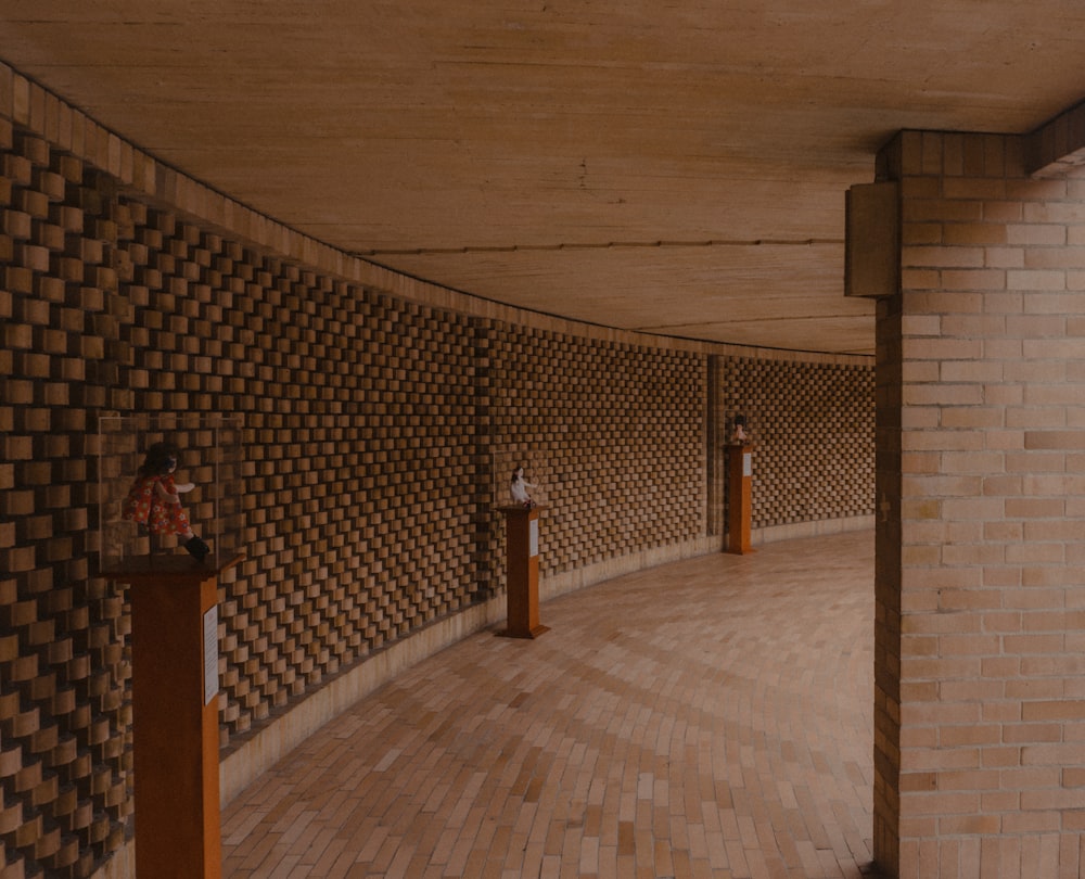 a room with a tile floor and a wood door