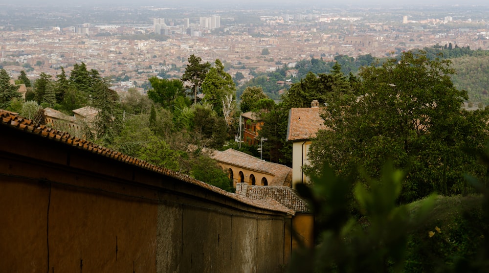 a building with a roof and trees in the back