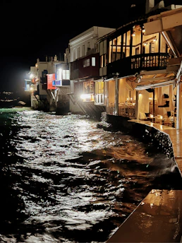 Evening view of Vibo Place with warm lights and lively atmosphere.