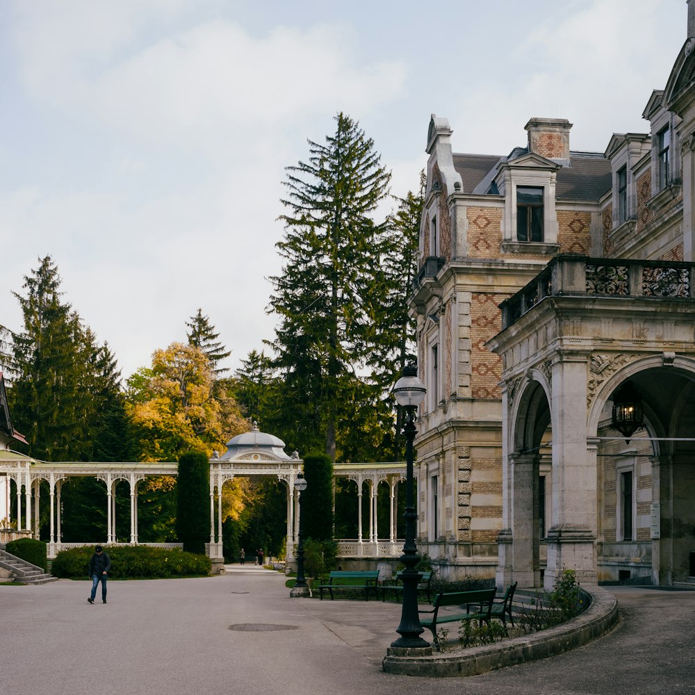 a large building with trees in front of it