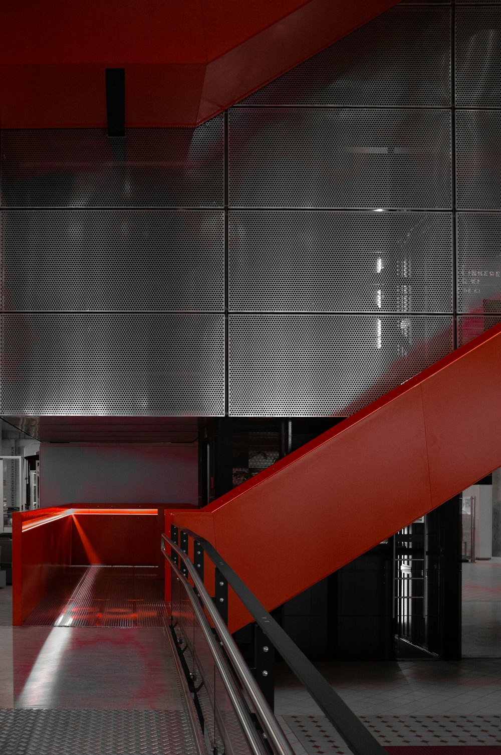 a red staircase in a building