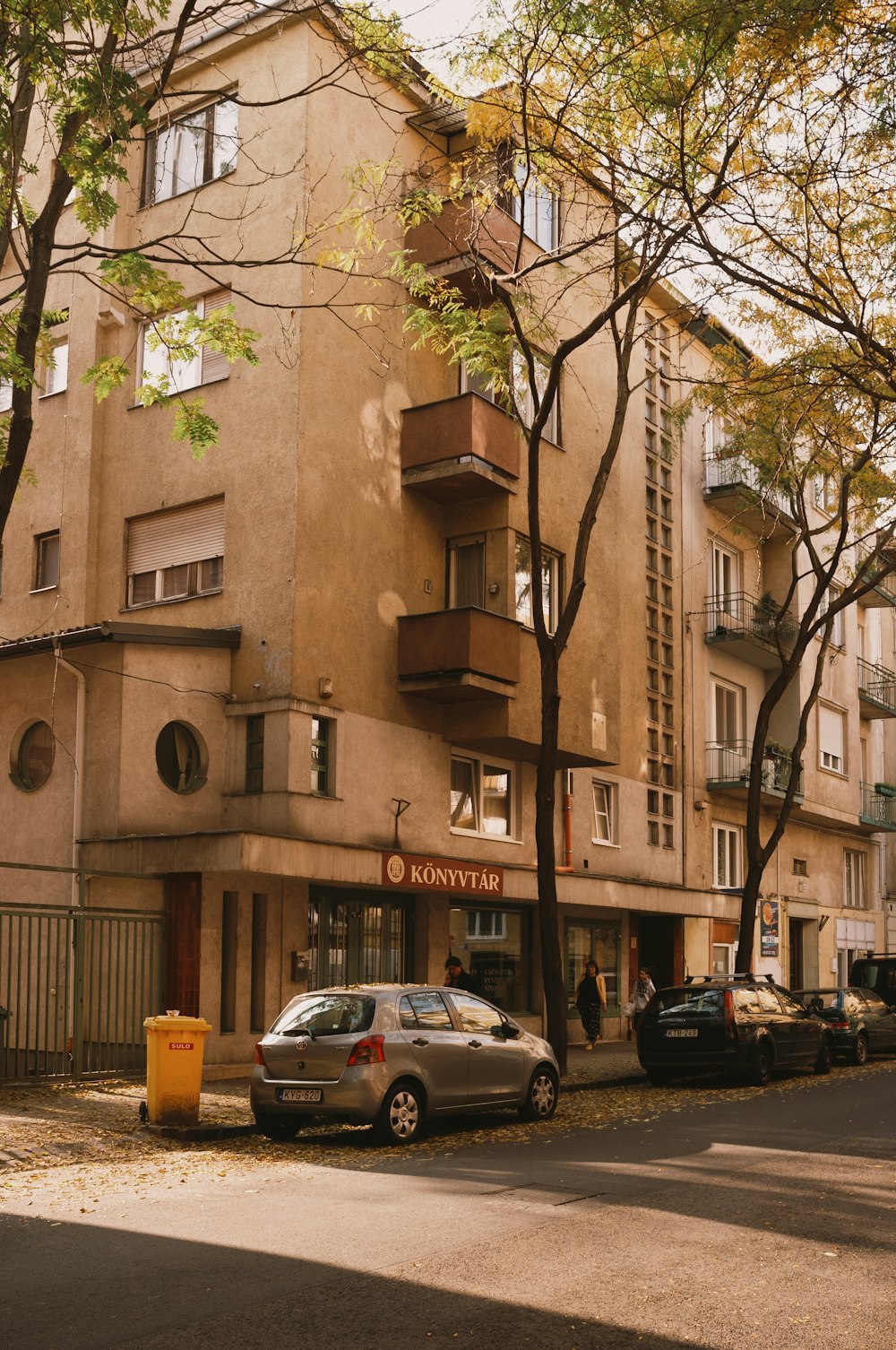 a building with cars parked in front