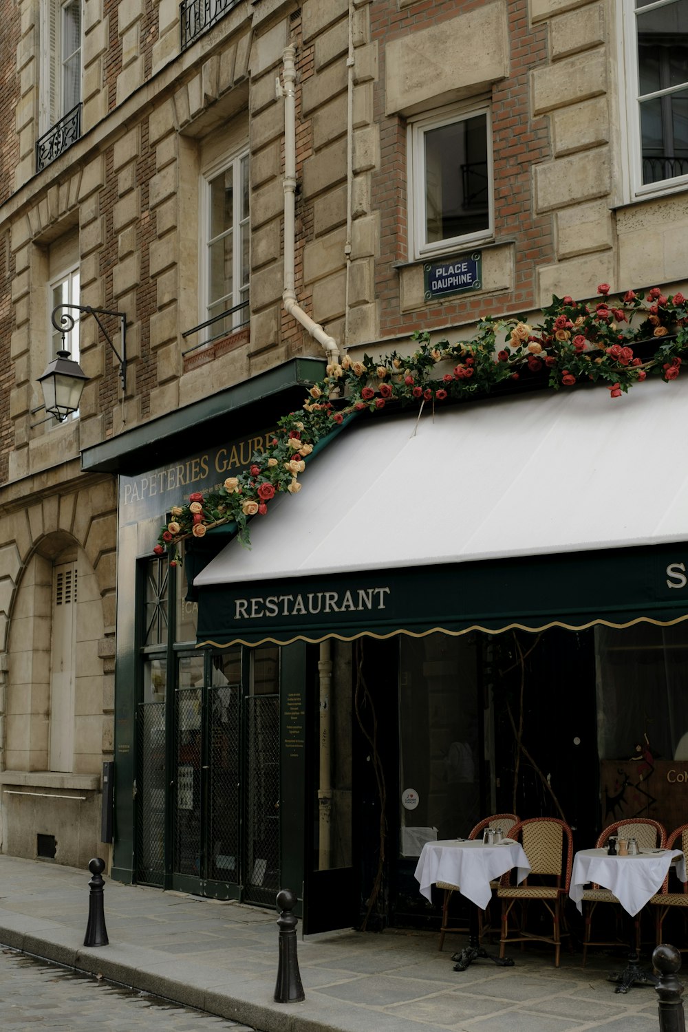 a restaurant with tables and chairs outside