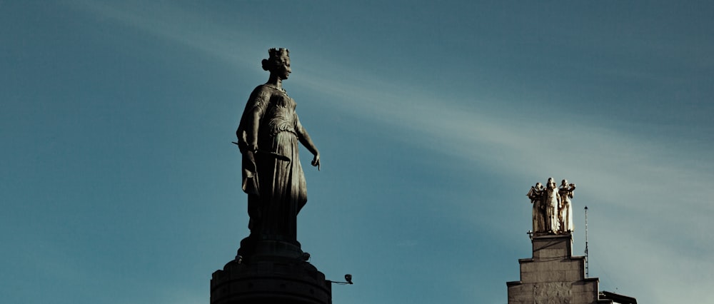 a statue of a person holding a torch