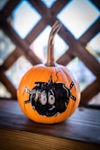 a pumpkin with a face drawn on it