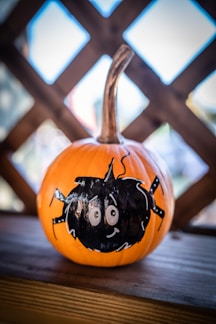a pumpkin with a face drawn on it