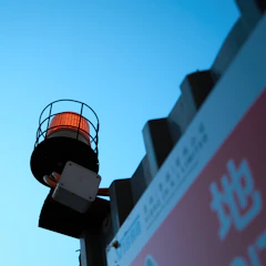a sign with a red and white shopping cart on top of it