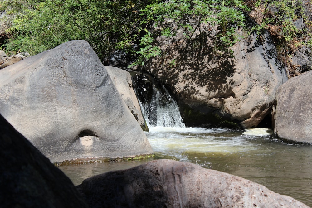 a waterfall over a rock