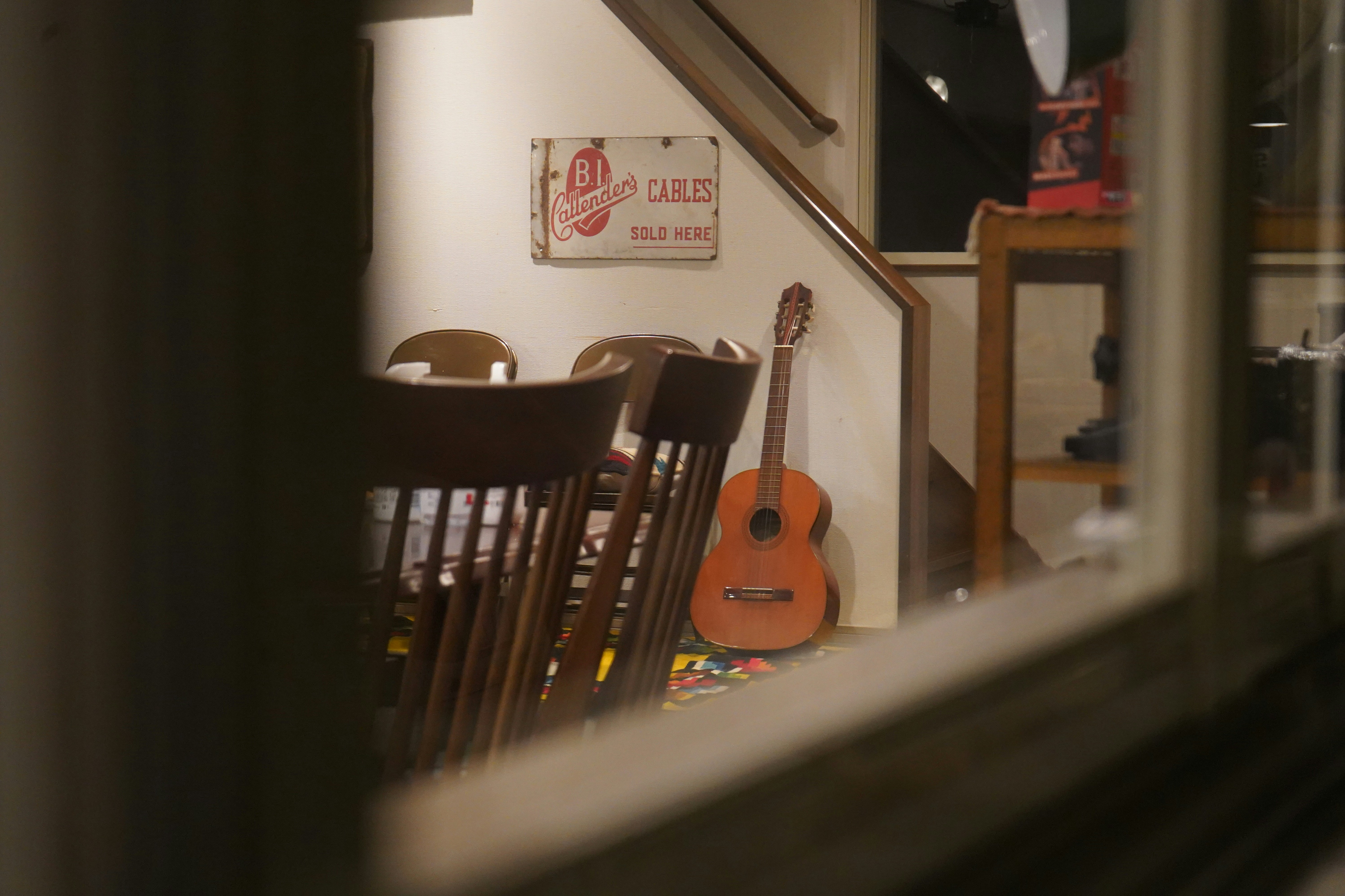 a guitar leaning against a wall