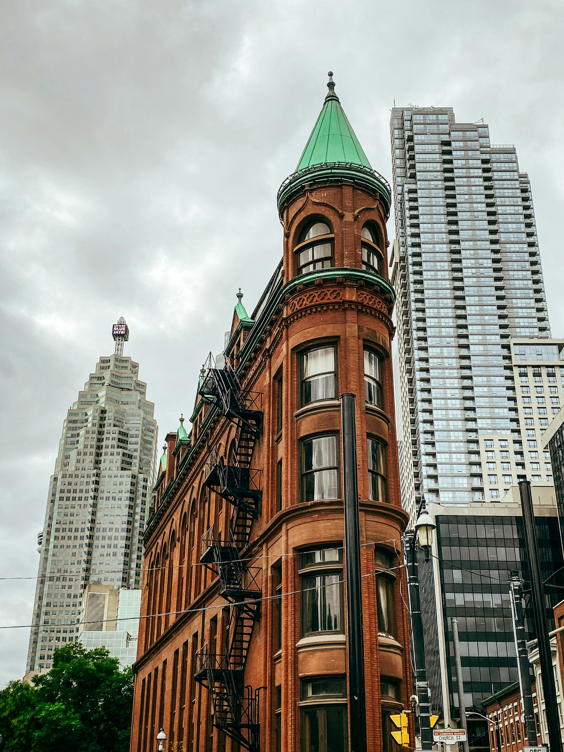 a tall building with a green roof
