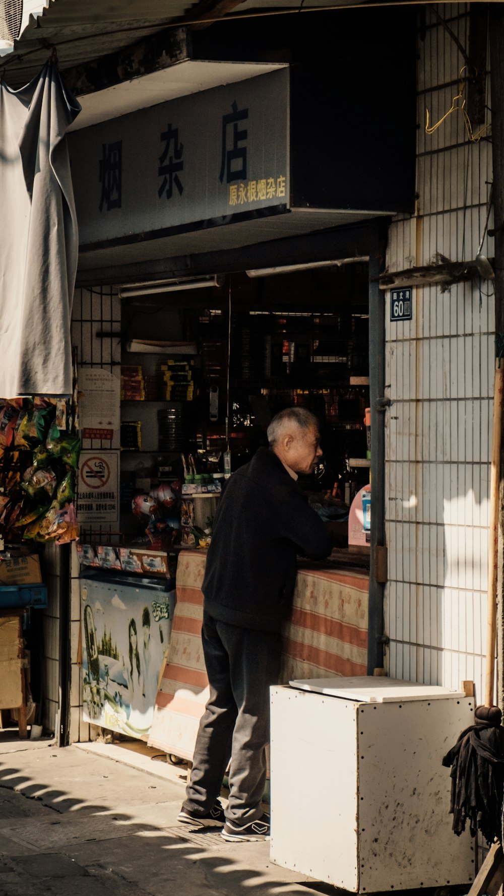 a man standing outside a store