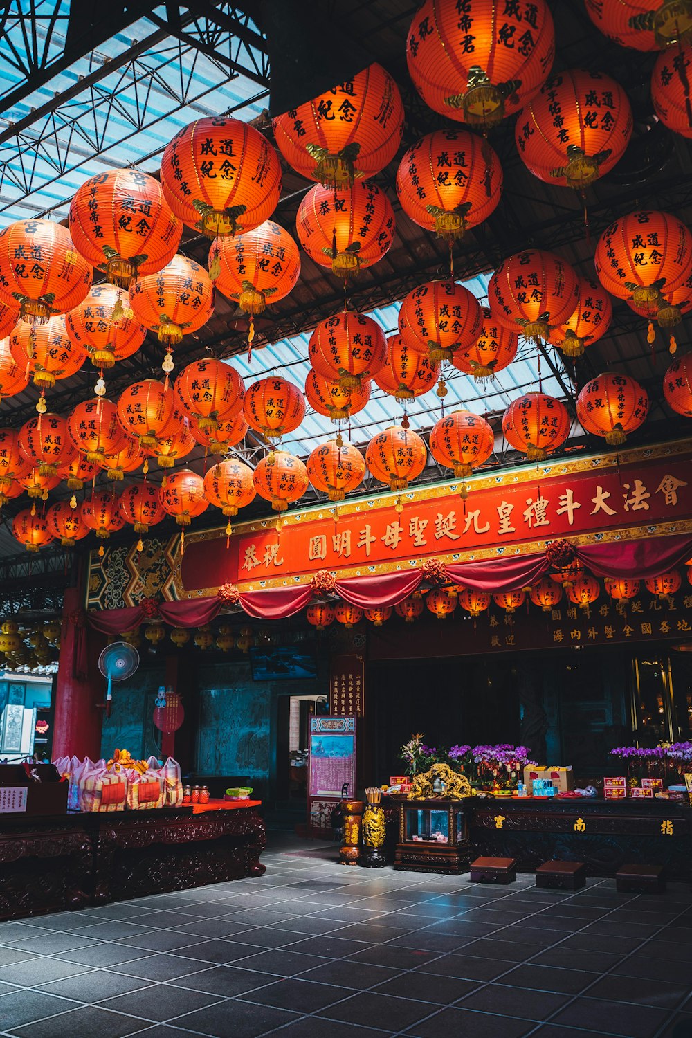 a building with lanterns from the ceiling