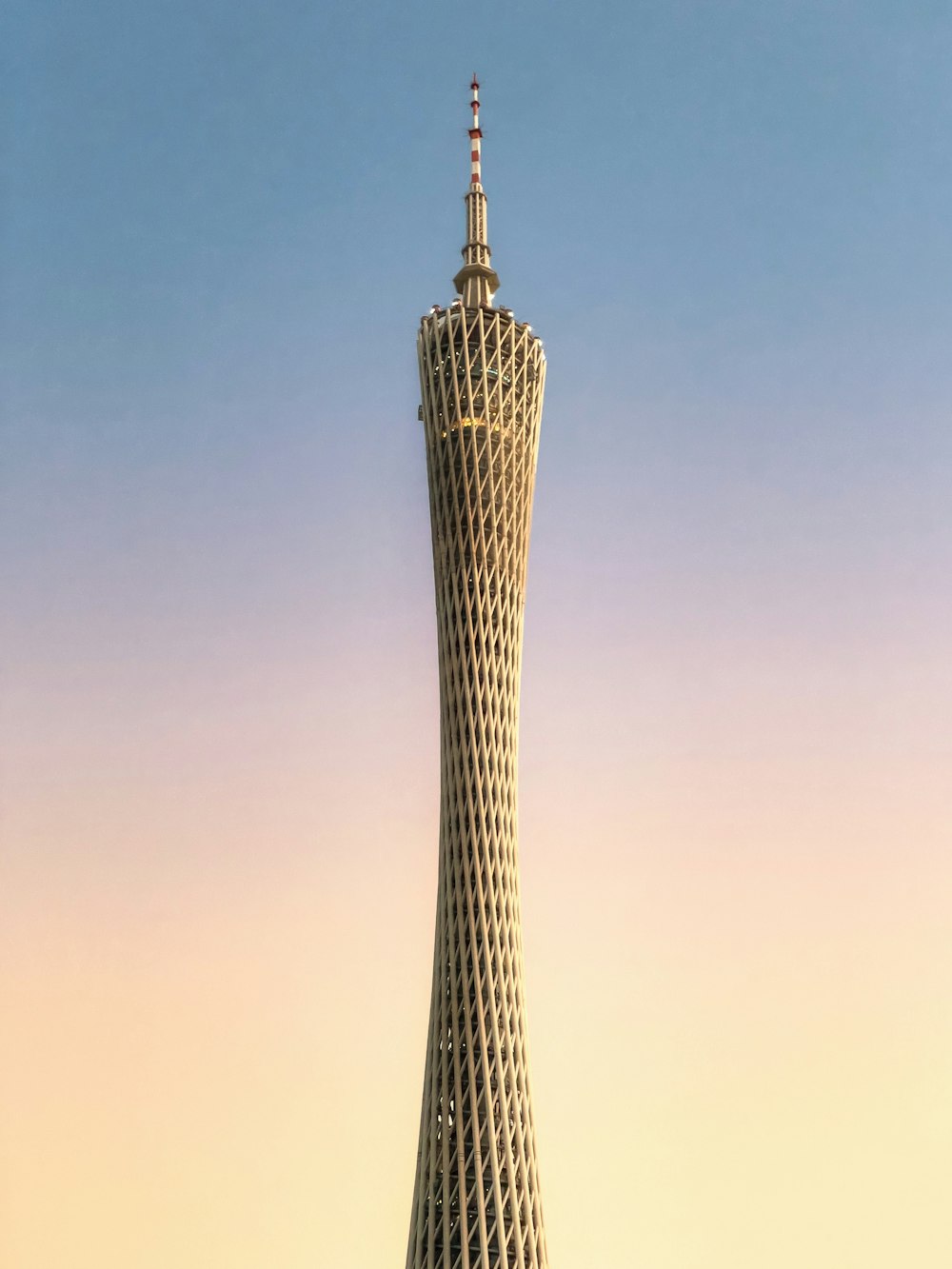a tall pointy tower with a clear sky