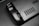 The image features a close-up view of a black gaming controller with visible buttons labeled R4 and R5. The surface appears sleek and matte, with a grid-like vent design next to the buttons. A partial brand name, 'VALVE', is visible in the corner.