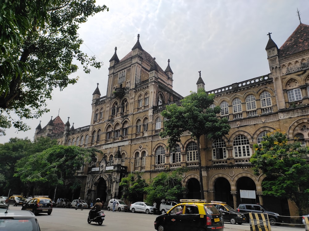 a large building with many windows with Chhatrapati Shivaji Terminus in the background