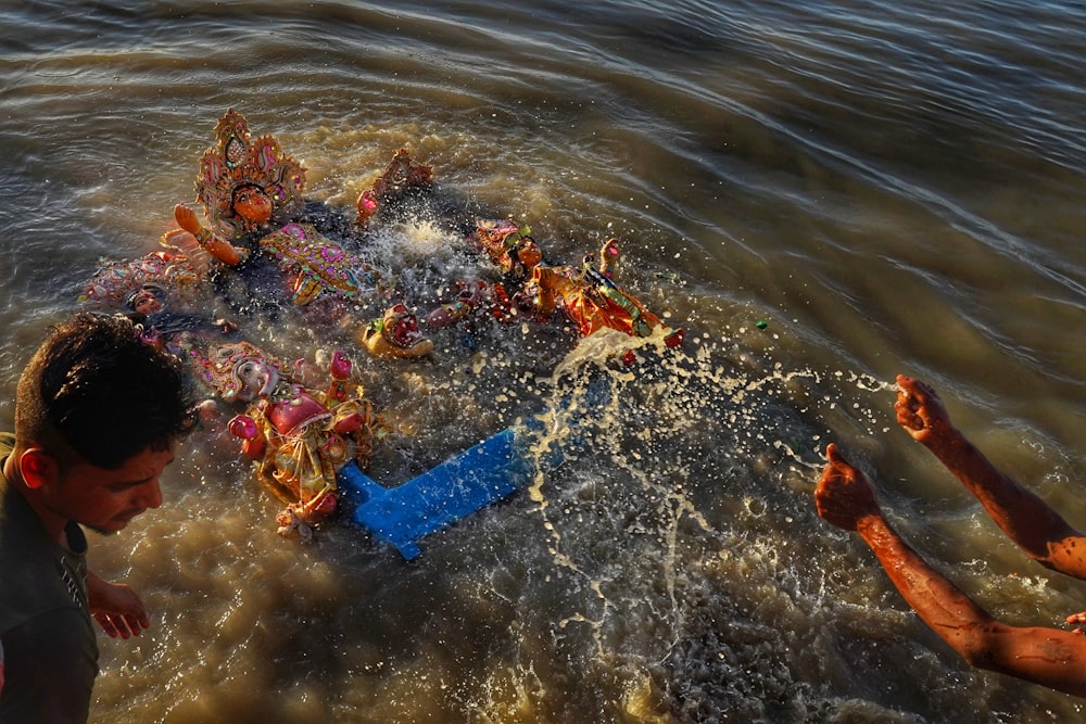 a group of people in the water