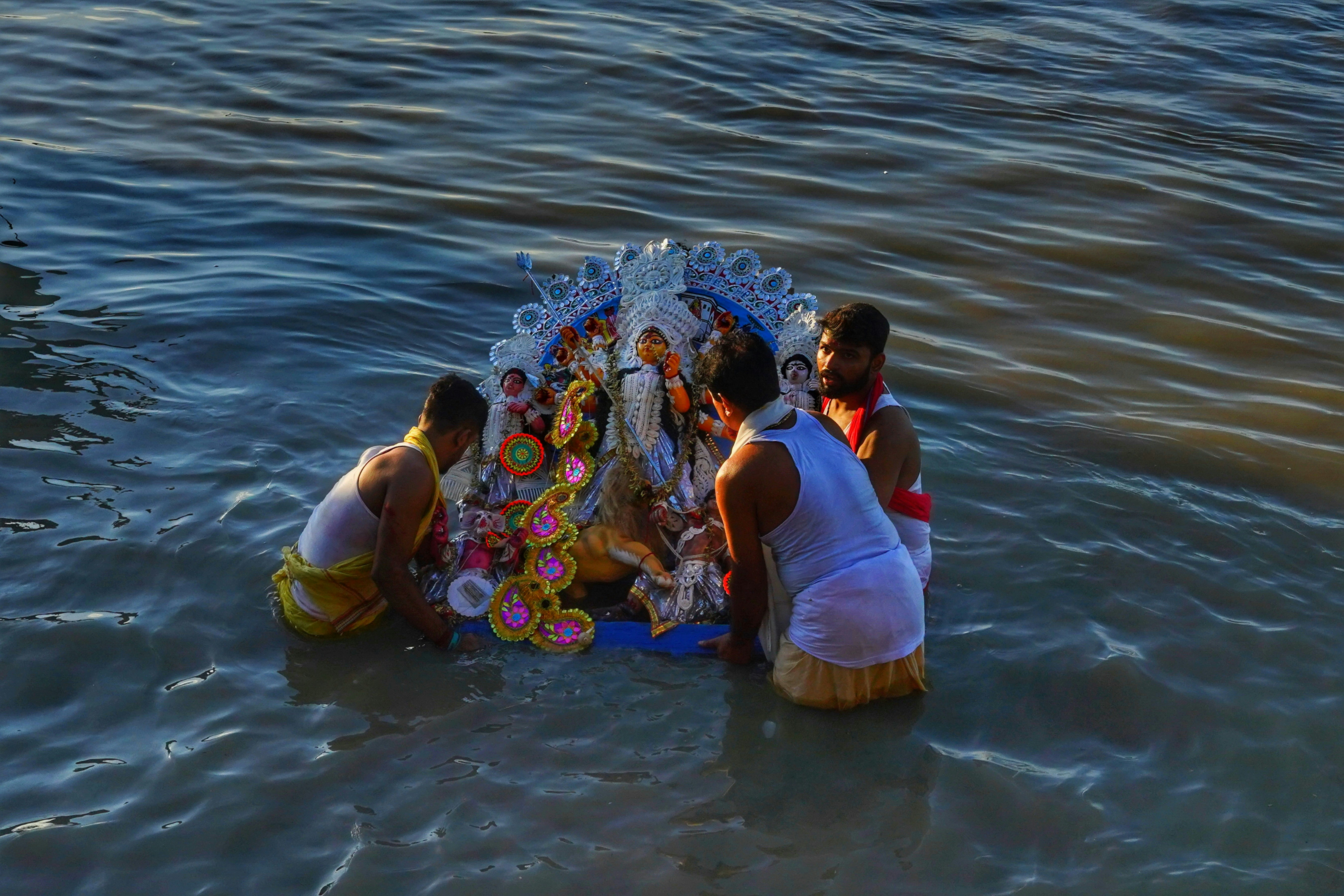 a group of people in the water, 